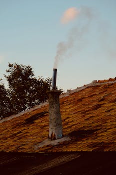 Charming old building with colorful walls and vintage ironwork under leafy trees