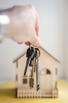Close up of a family holding house keys symbolizing home ownership
