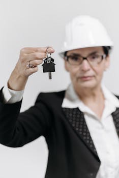 Couple and realtor reviewing a real estate contract inside a modern home