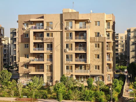 Happy Family in Front of Entry-Level Rent Purchase Home in Canada