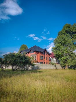 Mediterranean architecture home against a bright blue sky emphasizing rustic design