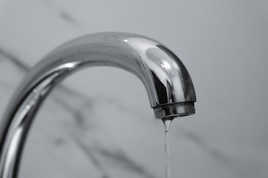 Worker painting facade