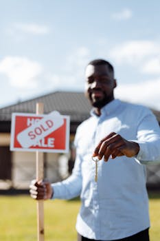 A couple embracing while holding a 'Home Sweet Home' sign, symbolizing new beginnings.
