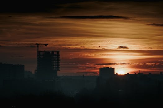 Canada Urban skyline at sunset with crane and buildings.