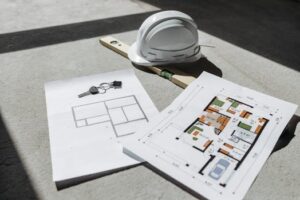 Close-up of a realtor handing over a house key to a new homeowner, symbolizing ownership and investment.