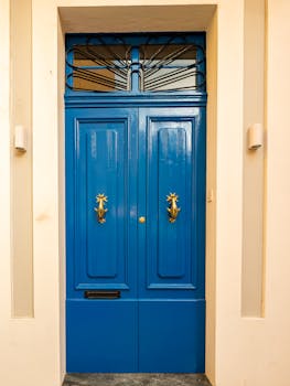 Rent Own Homes Canada 2024 Front view of a classic London townhouse adorned with colorful floral arrangements.